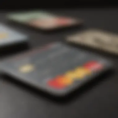 A close-up of a prepaid MasterCard held alongside budgeting tools.